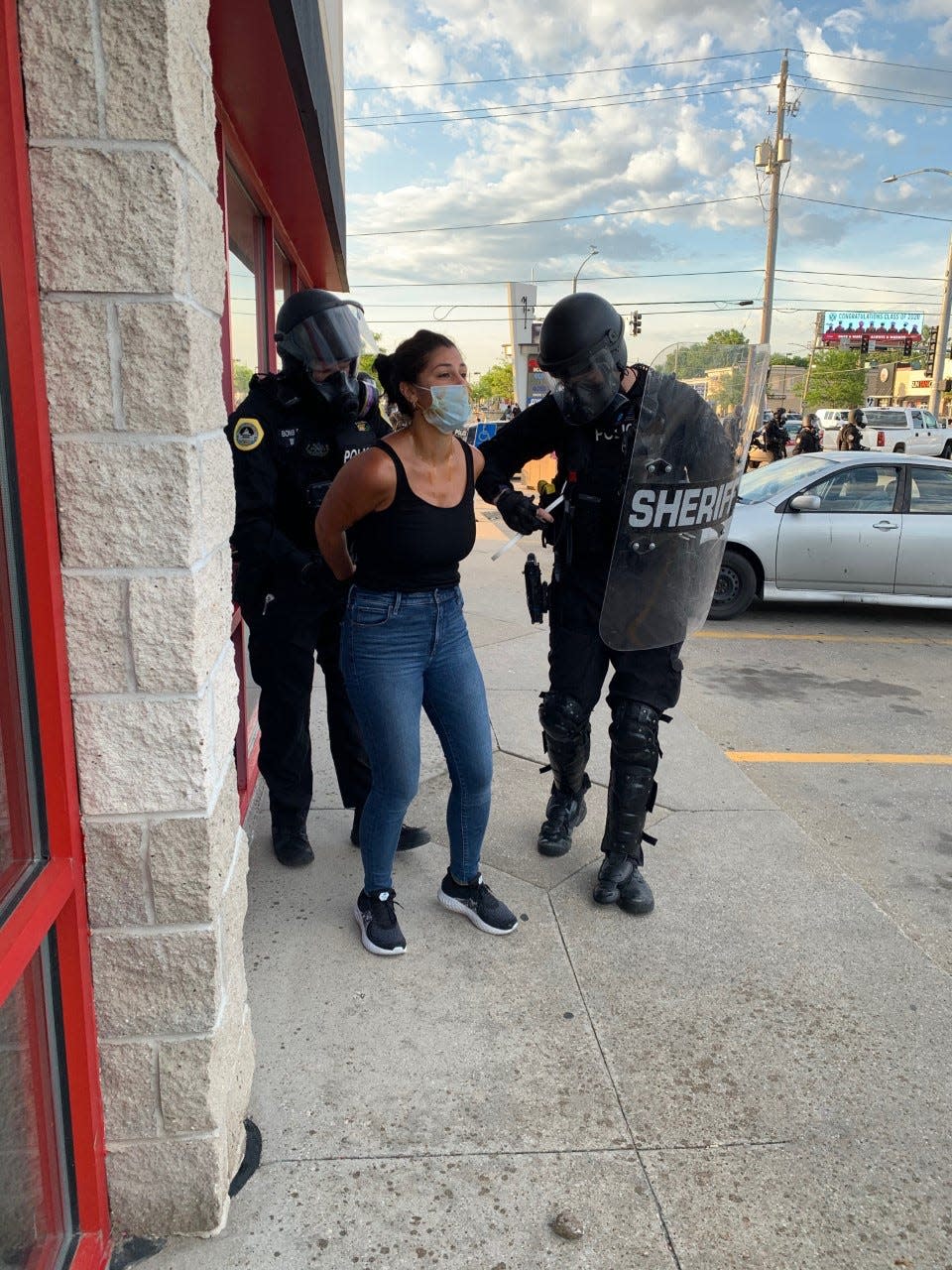 Des Moines Register reporter Andrea Sahouri is arrested by Des Moines police May 31 while covering a protest near Merle Hay Mall.