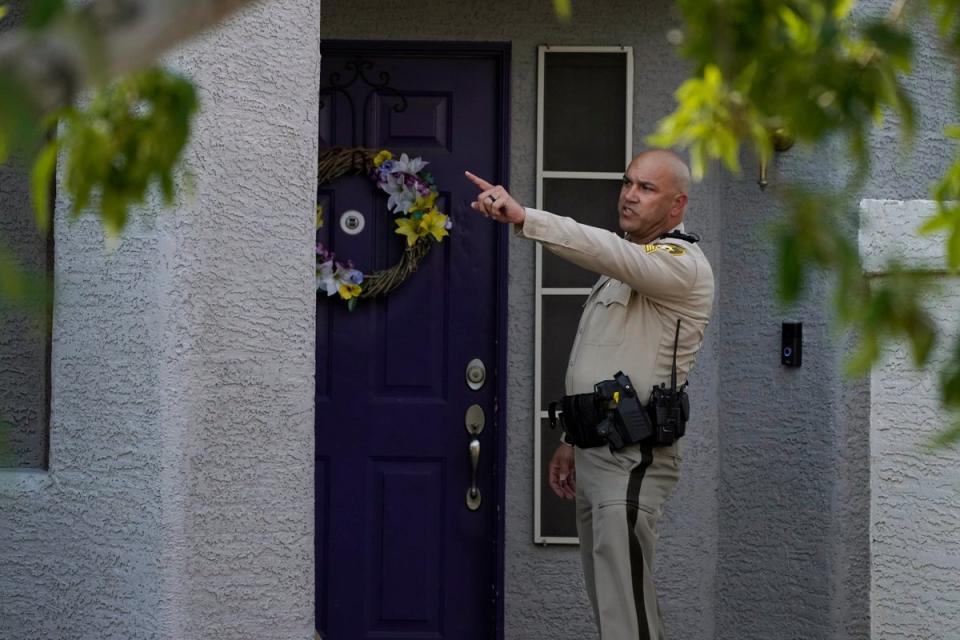 Law enforcement on the scene of the home of Rob Telles on Wednesday (Copyright 2022 The Associated Press. All rights reserved.)