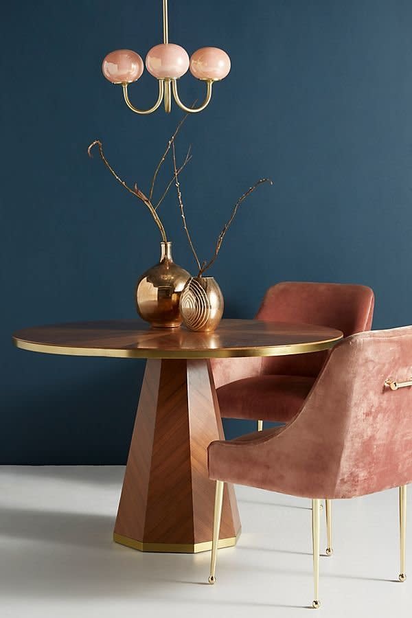 Get it at <a href="https://www.anthropologie.com/shop/quillen-dining-table?category=Furniture&amp;color=020" target="_blank" rel="noopener noreferrer">Anthropologie</a>, $898.&nbsp;