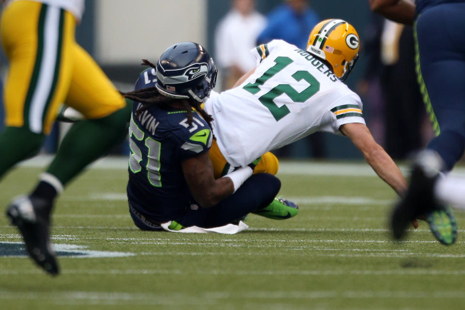 SEATTLE, WA - SEPTEMBER 24: Bruce Irvin #51 of the Seattle Seahawks sacks quarterback Aaron Rodgers #12 of the Green Bay Packers in the first half at Qwest Field on September 24, 2012 in Seattle, Washington. (Photo by Otto Greule Jr/Getty Images)