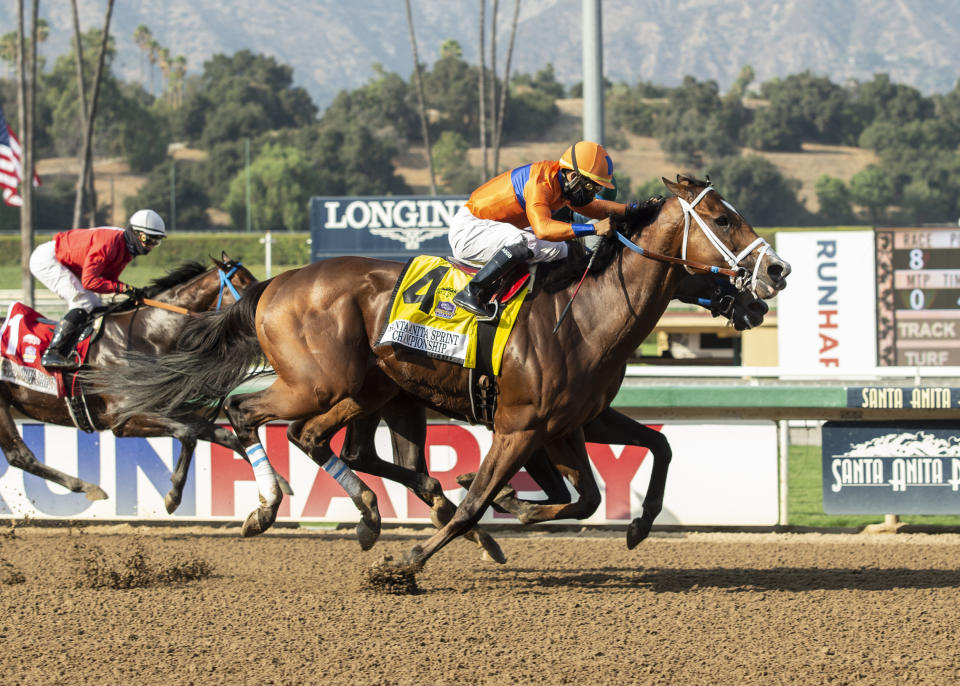 In a photo provided by Benoit Photo, C Z Rocket and jockey Luis Saez, outside, overpower Flagstaff (Victor Espinoza), inside, and Collusion Illusion (Flavien Prat), left, to win the Grade II, $200,000 Santa Anita Sprint Championship, Sunday, Sept. 27, 2020 at Santa Anita Park in Arcadia Calif.(Benoit Photo via AP)