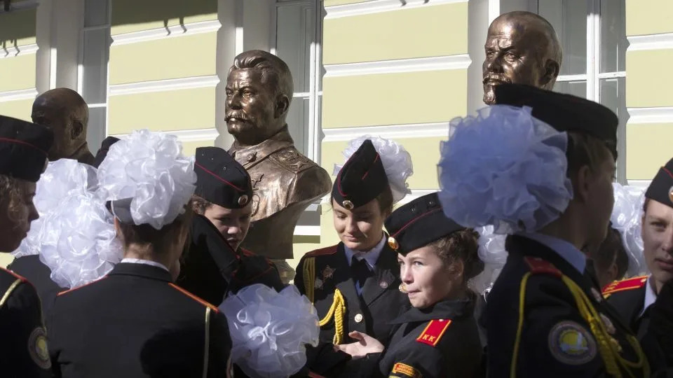 Students of a military-sponsored school attend the opening of a series of busts of Russian leaders, including Josef Stalin (center), in Moscow, on September 22, 2017. - Alexander Zemlianichenko/AP