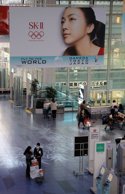 FILE PHOTO: Banner advertising SK-II, owned by P&G, an Olympic Games partner, is pictured at Haneda Airport in Tokyo