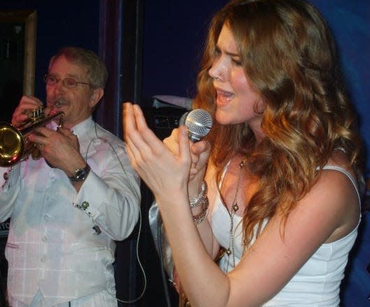 Hollie Farris playing trumpet with Joss Stone.