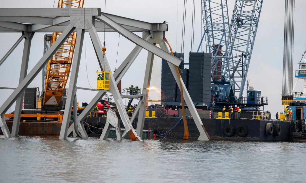 <span>Demolition crews cut top portion of the north side of the bridge into smaller sections for safe removal by crane in Baltimore, Maryland, on 30 March 2024.</span><span>Photograph: Kimberly Reaves/US COAST GUARD/AFP/Getty Images</span>