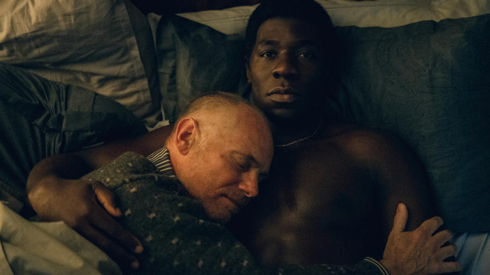 Mark Gillis lies his head on McKinley Belcher III's chest in bed in Eric.