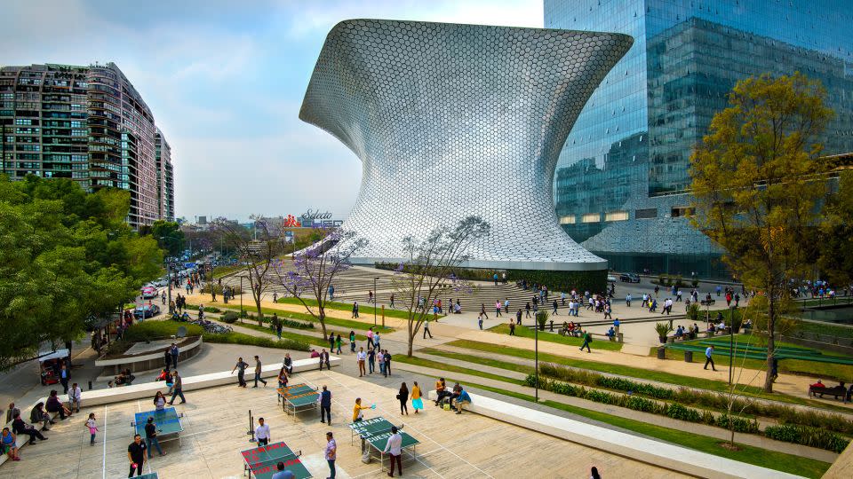 Mexico regularly ranks highly among countries offering satisfaction for expats. The aluminum-paneled Soumaya Museum stands in Plaza Carso in the Polanco district of Mexico City. - John Coletti/The Image Bank Unreleased/Getty Images