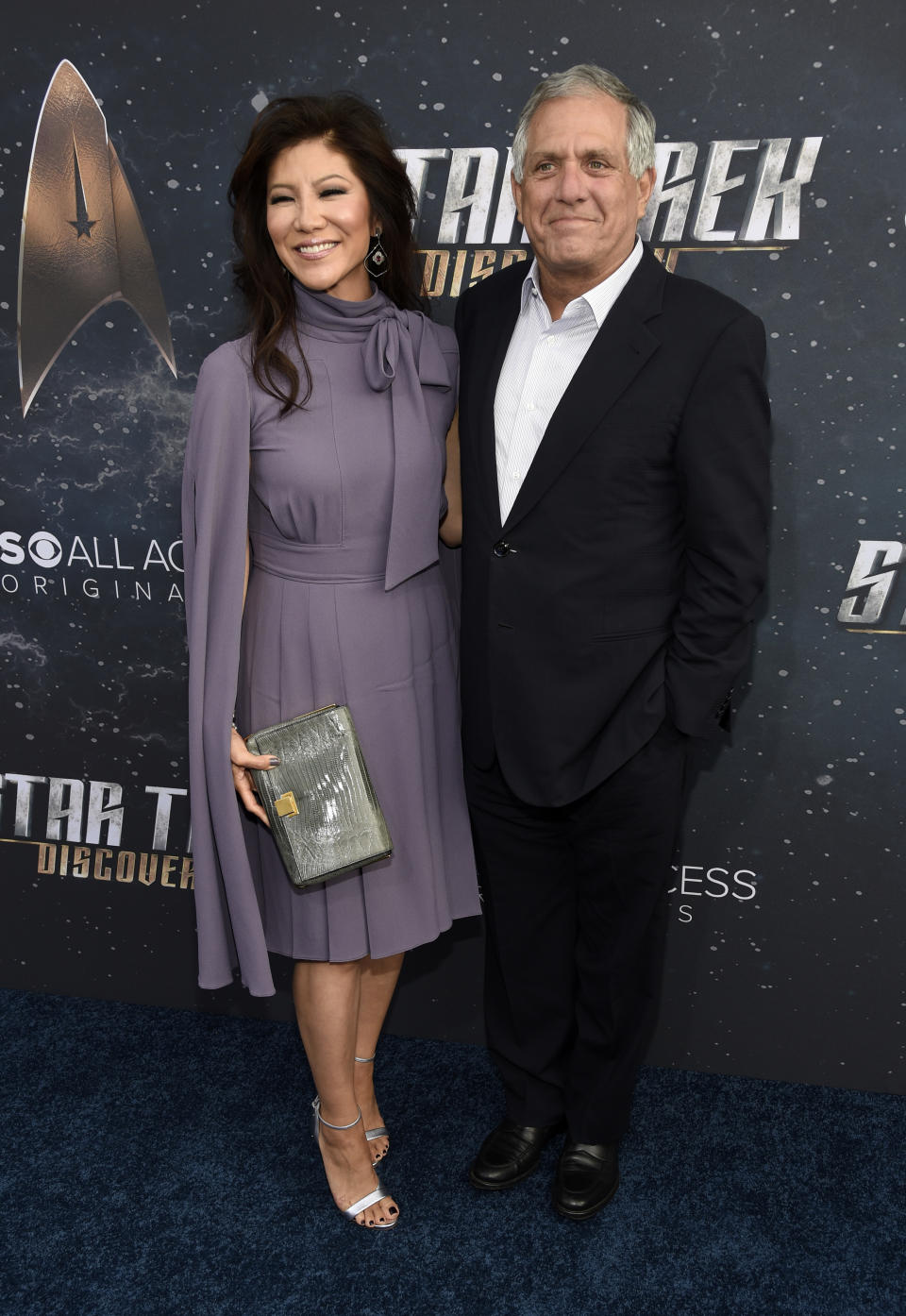 FILE - In this Sept. 19, 2017 file photo, Les Moonves, right, chairman and CEO of CBS Corporation, poses with his wife, television personality Julie Chen, at the premiere of the new television series "Star Trek: Discovery" in Los Angeles. Chen was absent from her talk CBS show, “The Talk” a day after a new round of sexual misconduct allegations against Moonves brought the departure of the CBS chief executive. In what was supposed to be a celebratory season premiere Monday, Sept. 10, 2018, the show's four other panelists walked out somberly without Chen, who acts as host and moderator. Sharon Osbourne choked back tears as she announced Chen would be taking time off to be with her family, and expressed support for her co-star and friend. (Photo by Chris Pizzello/Invision/AP, File)