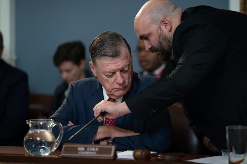 House Rules Committee Chairman Tom Cole, R-Okla., left, confers with an aide as his panel meets to prepare an appropriations bill for a floor vote at the Capitol in Washington, Friday, Sept. 29, 2023. With little time left to prevent a government shutdown, the House is effectively paralyzed as conservatives feud with Speaker Kevin McCarthy over matters large and small.