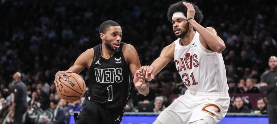 Feb 8, 2024; Brooklyn, New York, USA; Brooklyn Nets forward Mikal Bridges (1) looks to drive past Cleveland Cavaliers center Jarrett Allen (31) in the third quarter at Barclays Center. Mandatory Credit: Wendell Cruz-USA TODAY Sports