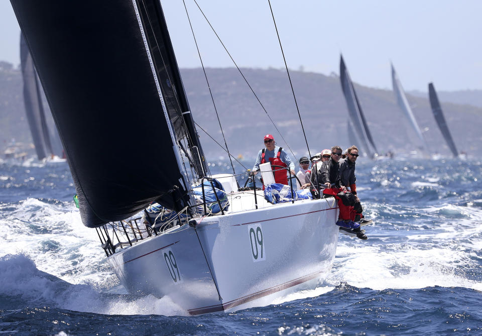 The U.S.A. yacht Privateer gets past the heads during the start of the Sydney Hobart yacht race in Sydney, Wednesday, Dec. 26, 2018. The 630-nautical mile race has 85 yachts starting in the race to the island state of Tasmania. (AP Photo/Rick Rycroft)