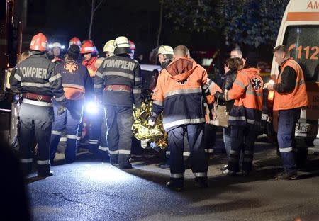 Emergency services work outside a nightclub in Bucharest, Romania October 31, 2015. REUTERS/Inquam Photos