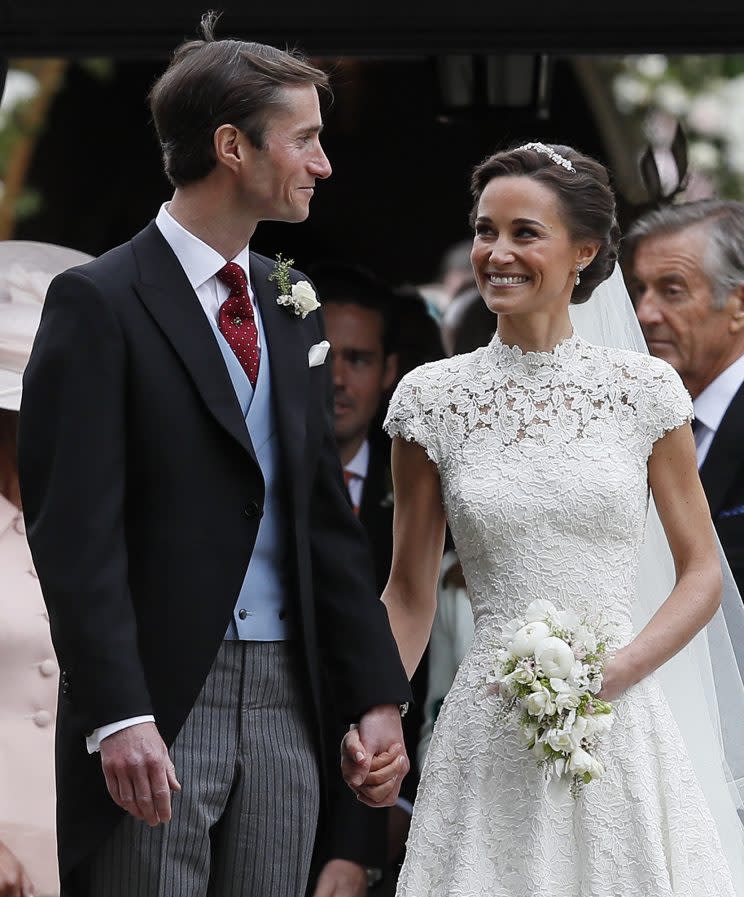 Pippa Middleton and James Matthews smile after their wedding at St. Mark’s Church in Englefield, England Saturday, May 20, 2017. Middleton, the sister of Kate, Duchess of Cambridge married hedge fund manager James Matthews in a ceremony Saturday where her niece and nephew Prince George and Princess Charlotte was in the wedding party, along with sister Kate and princes Harry and William. (AP Photo/Kirsty Wigglesworth, Pool)