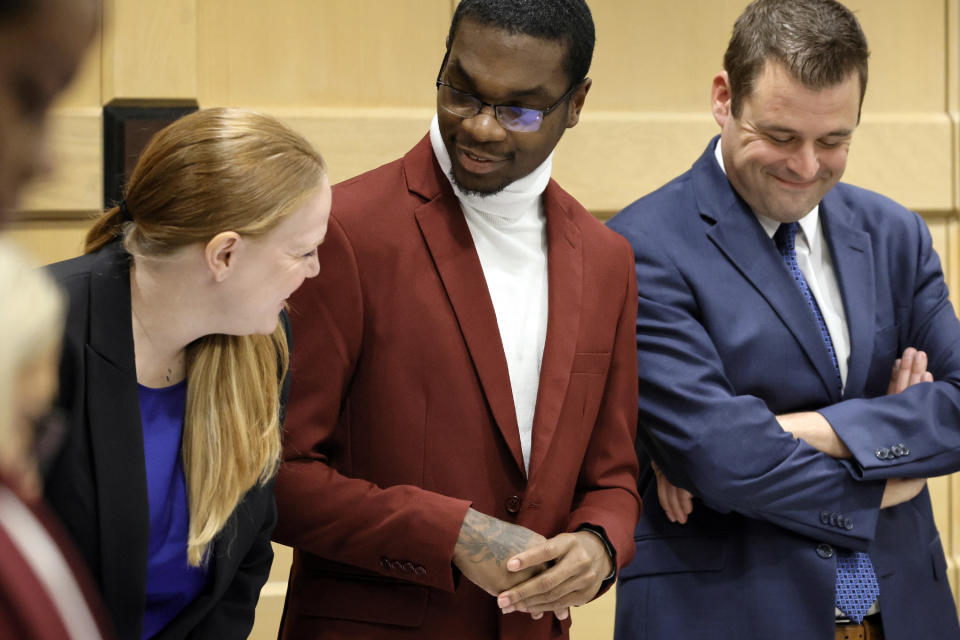 Shooting suspect Michael Boatwright, center, stands with his attorneys, Skyler Hill and Joseph Kimok, at they wait for the jury to enter the courtroom for day two of closing arguments in the XXXTentacion murder trial at the Broward County Courthouse in Fort Lauderdale, Fla., Wednesday, March 8, 2023. Emerging rapper XXXTentacion, born Jahseh Onfroy, 20, was killed during a robbery outside of Riva Motorsports in Pompano Beach in 2018, allegedly by defendants Boatwright, Trayvon Newsome, and Dedrick Williams. (Amy Beth Bennett/South Florida Sun-Sentinel via AP, Pool)