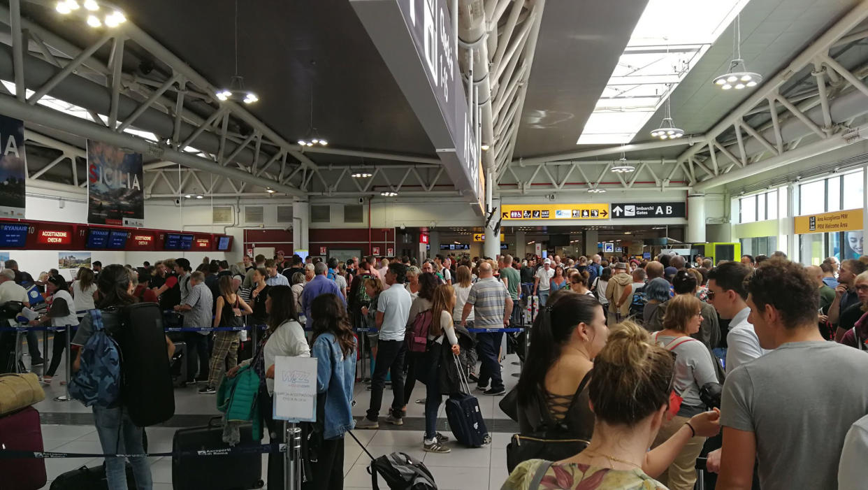 The scene at Stansted Airport on Saturday morning after Ryanair passengers were left unable to check in ahead of their flights due to a "systems outage" which caused delays at airports across Europe. (PA)