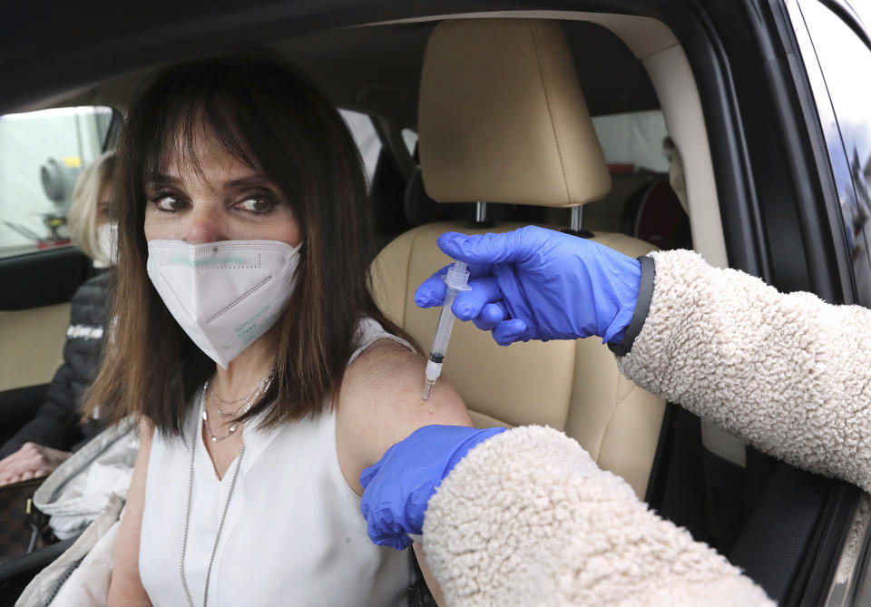 Nursing professor Pattie Troyan gets a Moderna COVID-19 vaccination at drive through testing site in Doraville, Georgia, US. Photo: Curtis Compton/Atlanta Journal-Constitution via AP