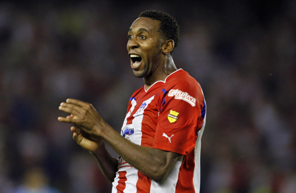 FILE - In this Feb. 24, 2011 file photo, Jhon Viafara of Colombia's Junior de Barranquilla celebrates after scoring against Brazil's Gremio during a Copa Libertadores soccer match in Barranquilla, Colombia. Viafara, a former Southampton and Portsmouth midfielder, has been arrested in his native Colombia on a U.S. drug warrant, said Colombia's chief prosecutor Wednesday, March 20, 2019. (AP Photo/Fernando Vergara, File)