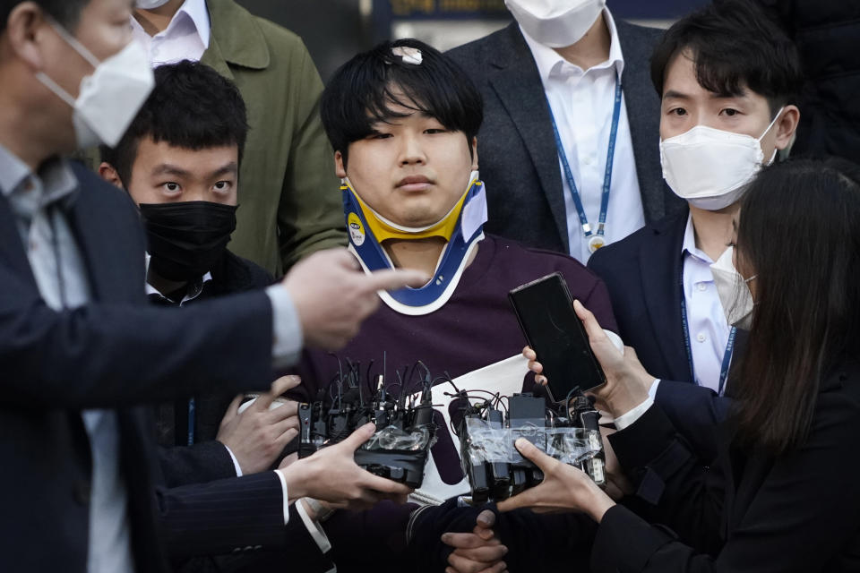 Cho Ju-bin, leader of South Korea's online sexual blackmail ring which is so called "Nth room," walks out of a police station as he is transferred to prosecutors' office for further investigation in Seoul, South Korea, Wednesday, March 25, 2020. South Korean prosecutors on Wednesday began reviewing whether to formally charge the man arrested last week on allegations he operated secretive chatrooms where he posted sexually abusive videos of blackmailed women in return for cryptocurrency payments. (Kim Hong-Ji/Pool Photo via AP)