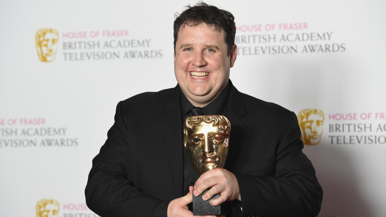  Peter Kay poses with his BAFTA Award for Male Performance in a Comedy Programme for Car Share in 2016. 