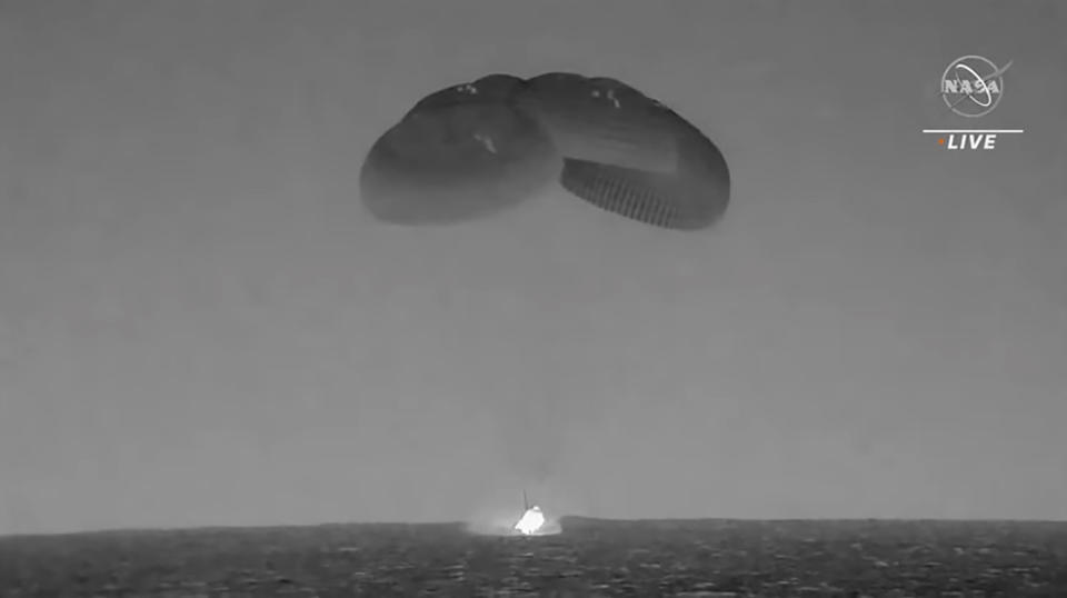 In this image from video made available by NASA, a SpaceX capsule, slowed by parachutes, splashes down in the Atlantic Ocean off the Florida coast, Monday, Sept. 4, 2023, as it returns to Earth with NASA astronaut Stephen Bowen, United Arab Emirates astronaut Sultan al-Neyadi, NASA astronaut Warren (Woody) Hoburg and Roscosmos cosmonaut Andrey Fedyaev after a six-month stay at the International Space Station. (NASA via AP)