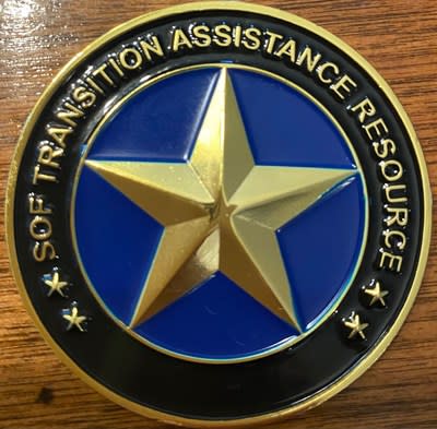 Kathleen was given a “Challenge Coin” after giving a speech at a SOF
transition assistance event.   She discussed the top three (3) GAPS in the
SOF transition process and the critical tactics needed to be successful. A
challenge coin is a symbol of commitment and morale and serves as a token
of appreciation or thanks..