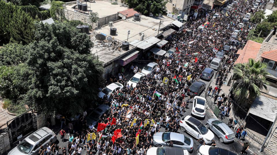 Mourners march in Jenin during Wednesday's funeral. - Jaafar Ashtiyeh/AFP/Getty Images