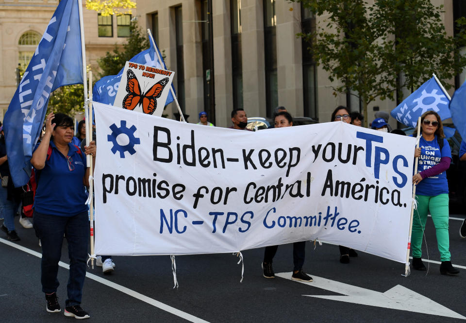 Activists and citizens with Temporary Protected Status march near the White House on Sept. 23, 2022. / Credit: OLIVIER DOULIERY/AFP via Getty Images