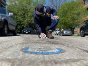 Chicago artist Jim Bachor creates four pandemic-themed pothole mosaics on the city's North Side