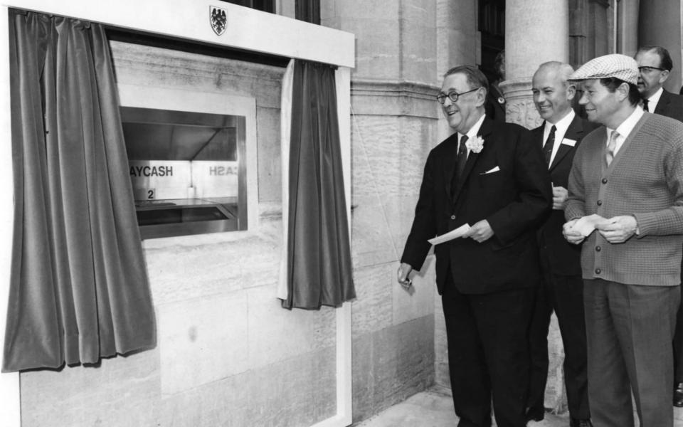 Britain's first cash machine opened in 1967, but use of physical money is now falling - Fox Photos
