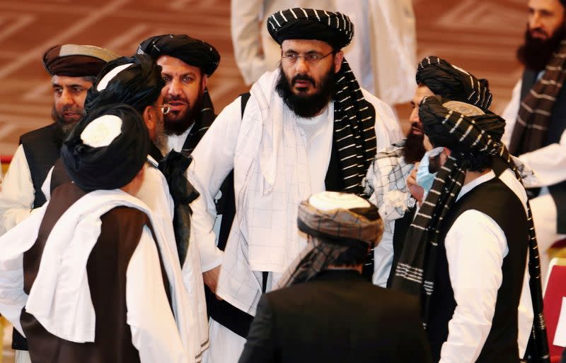 FILE PHOTO: Taliban delegates speak during talks between the Afghan government and Taliban insurgents in Doha, Qatar