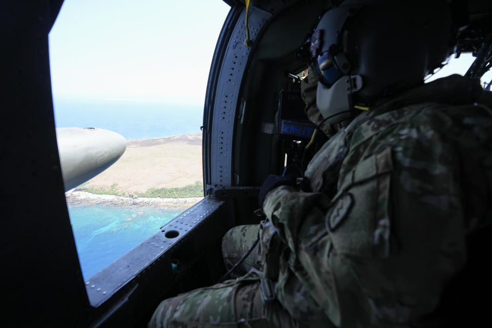 A U.S. Army UH-60 Blackhawk helicopter flies over Batanes islands towards Itbayat, the Philippines' northernmost town, during a joint military exercise on Monday, May 6, 2024. American and Filipino marines held annual combat-readiness exercises called Balikatan, Tagalog for shoulder-to-shoulder, in a show of allied military readiness in the Philippines' northernmost town facing southern Taiwan. (AP Photo/Aaron Favila)