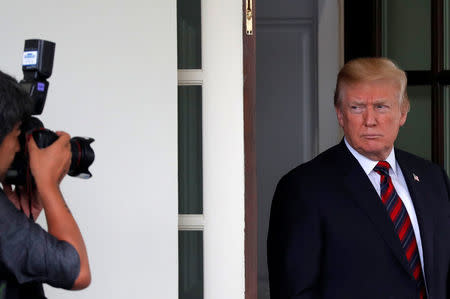 U.S. President Donald Trump looks at a photographer after a meeting with South Korea's President Moon Jae-In at the White House in Washington, U.S., May 22, 2018. REUTERS/Carlos Barria