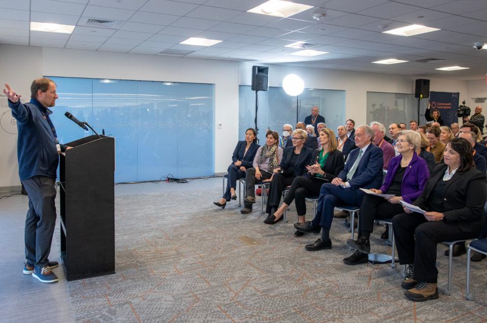 Commonwealth Fusion Systems CEO Bob Mumgaard, left, speaks at the ribbon cutting ceremony for the company’s campus Friday in Devens.