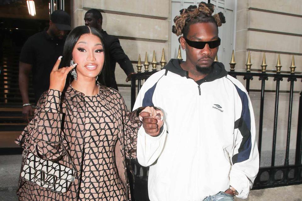 <p>SplashNews.com</p> Cardi B and Offeset pictured coming out of the Balenciaga store on July 4, 2023