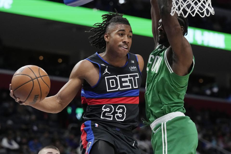 Pistons guard Jaden Ivey passes the ball as Celtics forward Noah Vonleh defends during the second half on Saturday, Nov. 12, 2022, at Little Caesars Arena.