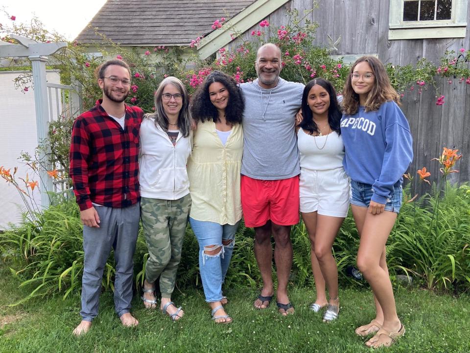 Allison Reilly (in camo pants) and her husband, Ian Dowe (in red shorts), with their children outside their summer 2020 rental home in Harwich on Cape Code.