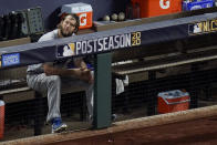 Los Angeles Dodgers starting pitcher Clayton Kershaw sits in the dugout after leaving the game during the sixth inning in Game 4 of a baseball National League Championship Series against the Atlanta Braves Thursday, Oct. 15, 2020, in Arlington, Texas. (AP Photo/Sue Ogrocki)