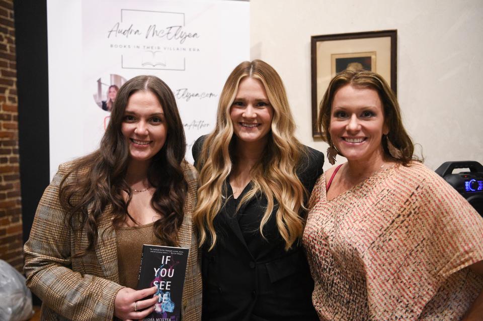 From left, voice actor Bailey Carr, author Audra McElyea and voice actor Amanda Stribling pose for a photo at McElyea’s book launch at Addison’s Bookstore on Gay Street, Friday, Jan. 5, 2024.