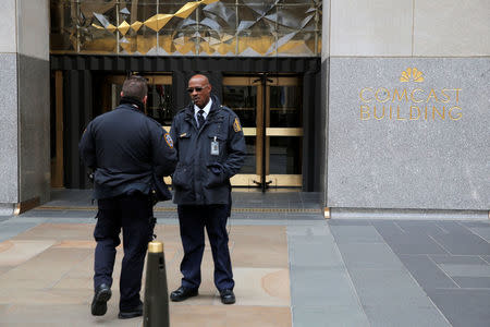 Police and security stand outside 30 Rockefeller Plaza, the location for the offices of U.S. President Donald Tump's lawyer Michael Cohen which was raided by the F.B.I. today in the Manhattan borough of New York City, New York, U.S., April 9, 2018. REUTERS/Andrew Kelly