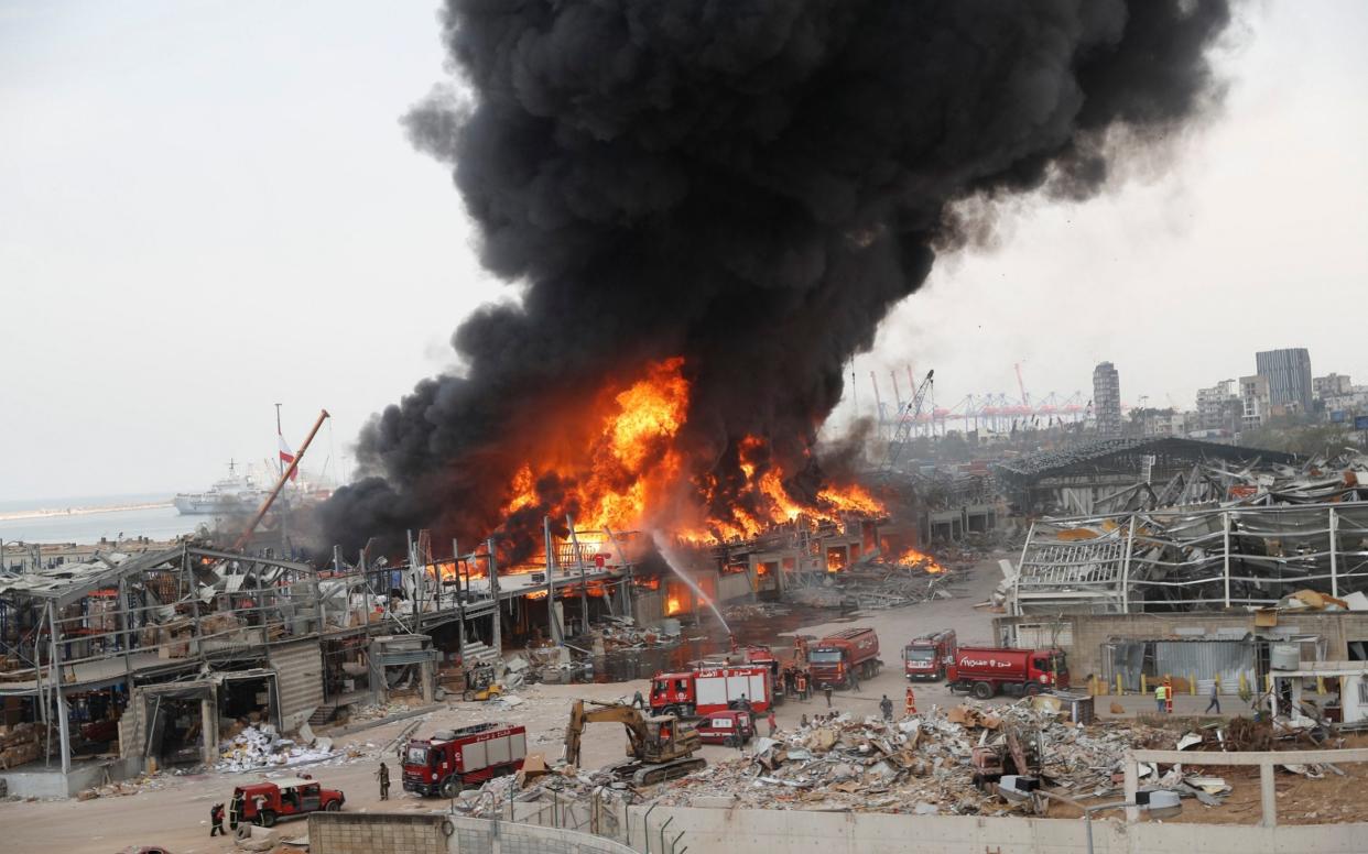 Fire burns in the port in Beirut, Lebanon - AP/ Hussein Malla