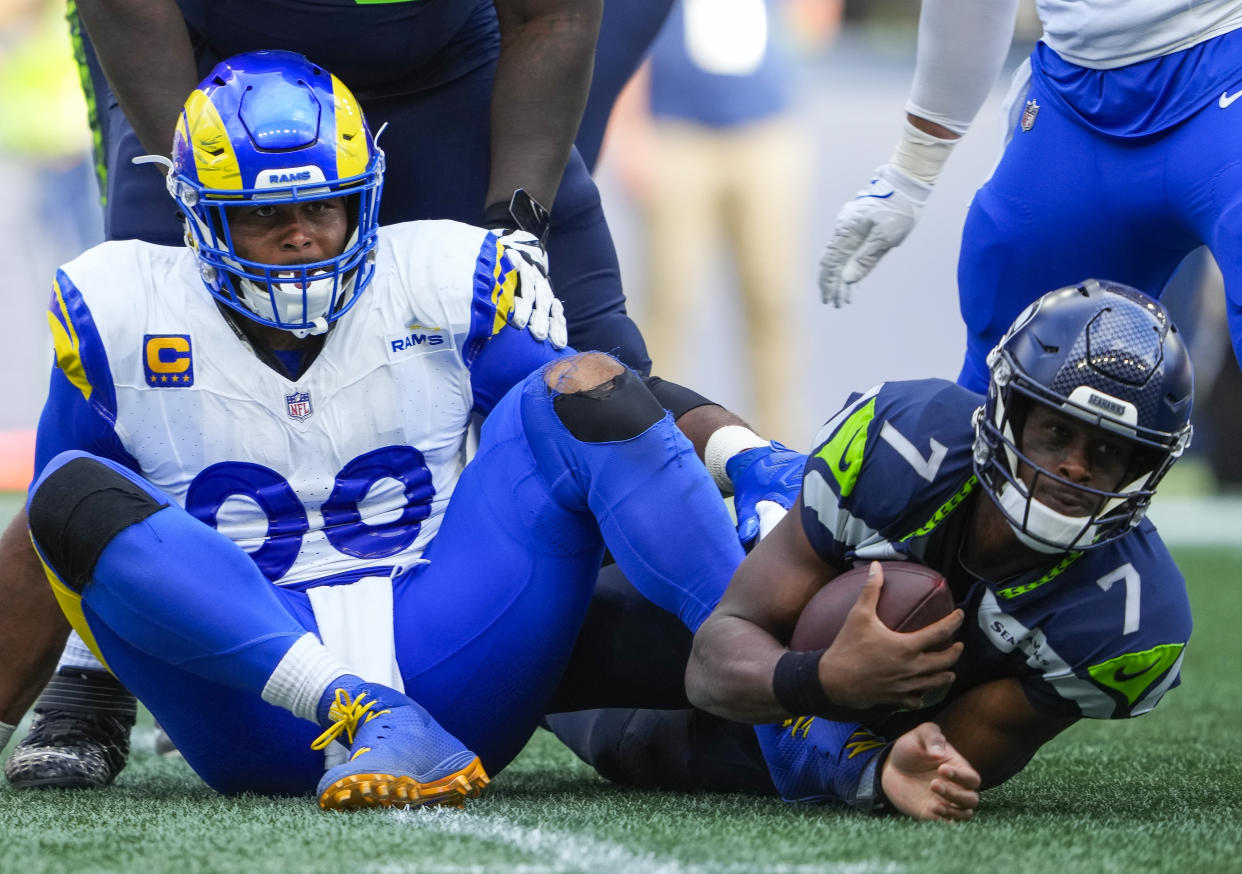 Los Angeles Rams defensive tackle Aaron Donald (99) looks on after sacking \tps7m\ during the second half of an NFL football game, Sunday, Sept. 10, 2023, in Seattle. (AP Photo/Lindsey Wasson)