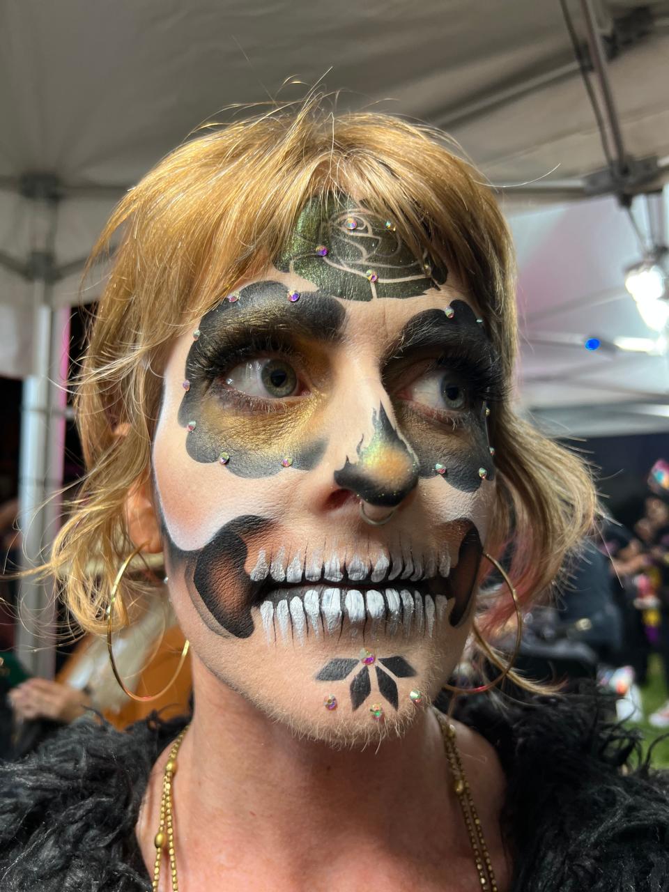 Carmen Delaney of Los Angeles shows off her Day of the Dead makeup at the Día de Los Muertos celebration at the Hollywood Forever Cemetery in Los Angeles on Saturday, Oct. 28, 2023.