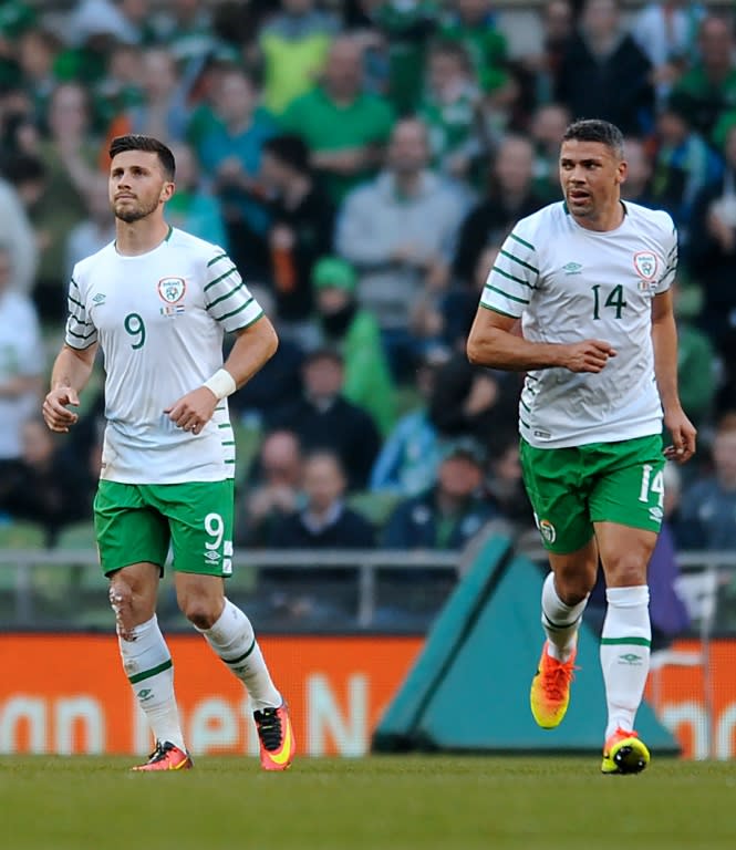 Ireland's striker Shane Long (L) celebrates after scoring his team's goal during the friendly football match against the Netherlands, in Dublin on May 27, 2016