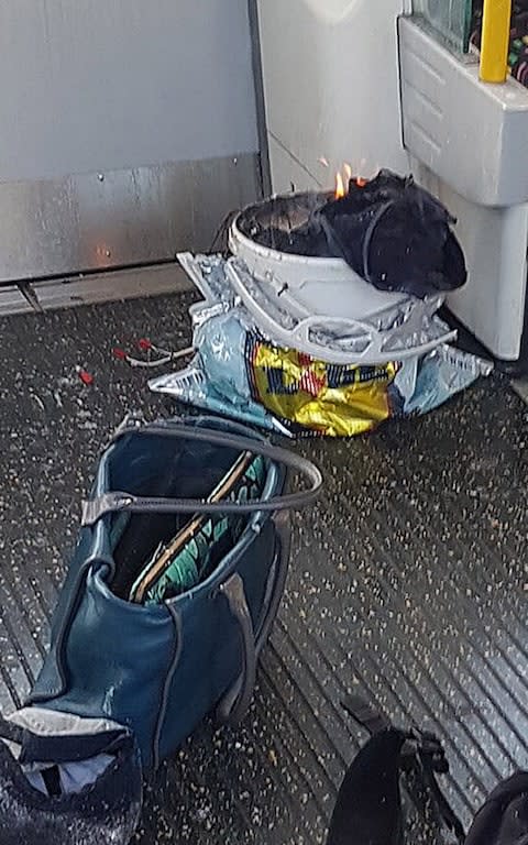  a bucket on fire on a tube train at Parsons Green station - Credit: Sylvain Pennec/PA