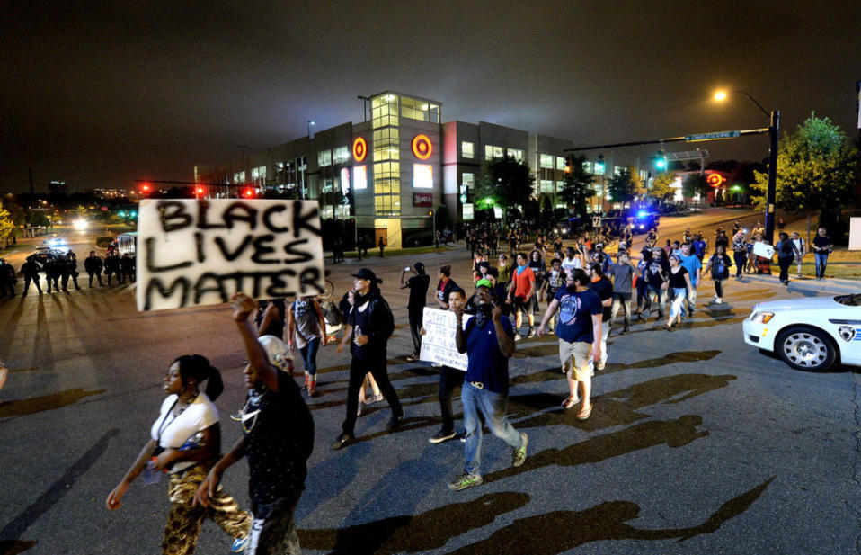 <p>Protesters march down Kings Drive to the Cherry Community Sunday, Sept. 25, 2016 in Charlotte, N.C. (Jeff Siner/Charlotte Observer/TNS via Getty Images)</p>