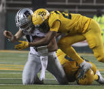 Kansas State quarterback Will Howard (15) is hit in the helmet by Baylor safety JT Woods (22) in the first half of an NCAA college football game, Saturday, Nov. 28, 2020, in Waco, Texas. Woods was ejected from the game for targeting. (Jerry Larson/Waco Tribune-Herald via AP)