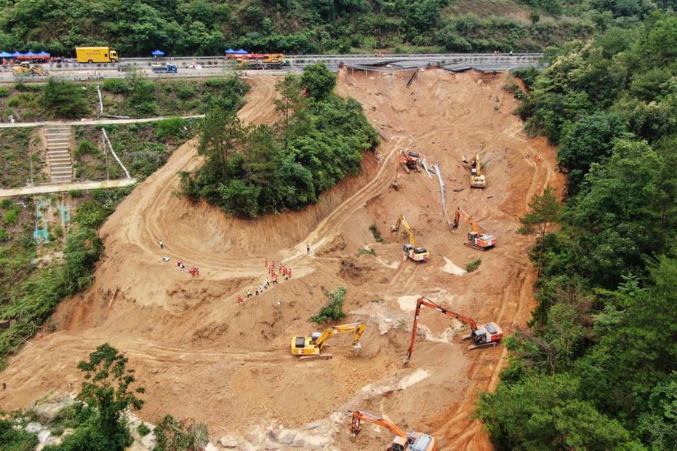 A photo taken on May 2, 2024, shows rescuers and excavators working at the site (AP)