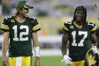 Green Bay Packers' Aaron Rodgers and Davante Adams smile as they walk off the field after an NFL football game against the Detroit Lions Monday, Sept. 20, 2021, in Green Bay, Wis. The Packers won 35-17. (AP Photo/Matt Ludtke)