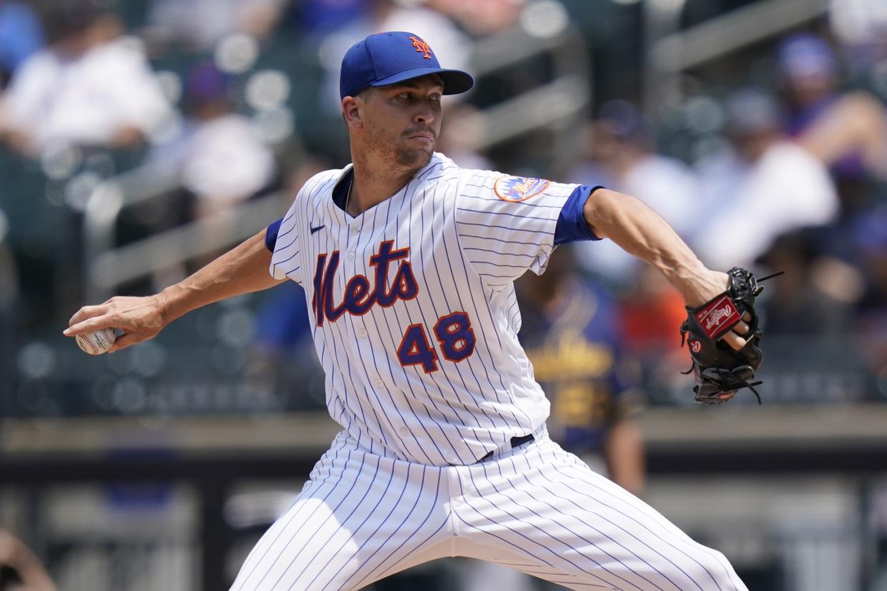 FILE - New York Mets' Jacob deGrom delivers a pitch during the first inning of the first baseball game of a doubleheader against the Milwaukee Brewers Wednesday, July 7, 2021, in New York. New York Mets ace Jacob deGrom is finally ready to begin a minor league rehab assignment. Sidelined by injuries since last July, the two-time Cy Young Award winner is scheduled to start Sunday night, July 3, 2022 for Class A St. Lucie against the Jupiter Hammerheads.(AP Photo/Frank Franklin II, File)