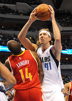 Carl Landry's teeth opened a deep gash to Dirk Nowitzki's elbow during this collision